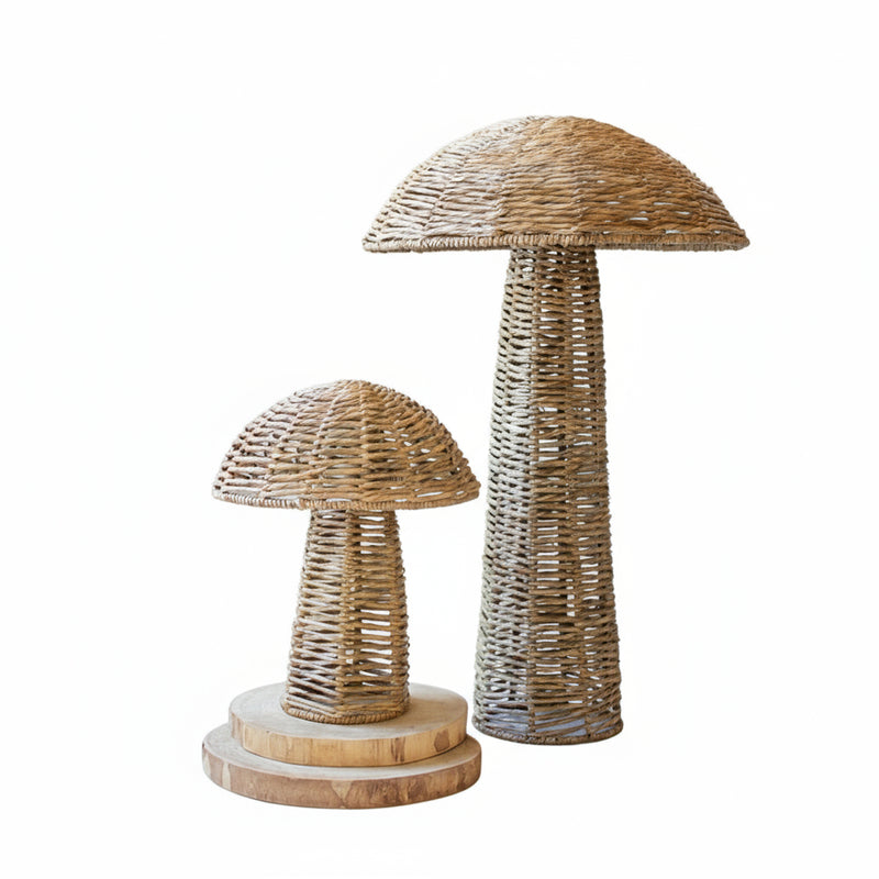 Two woven mushroom sculptures on a white background